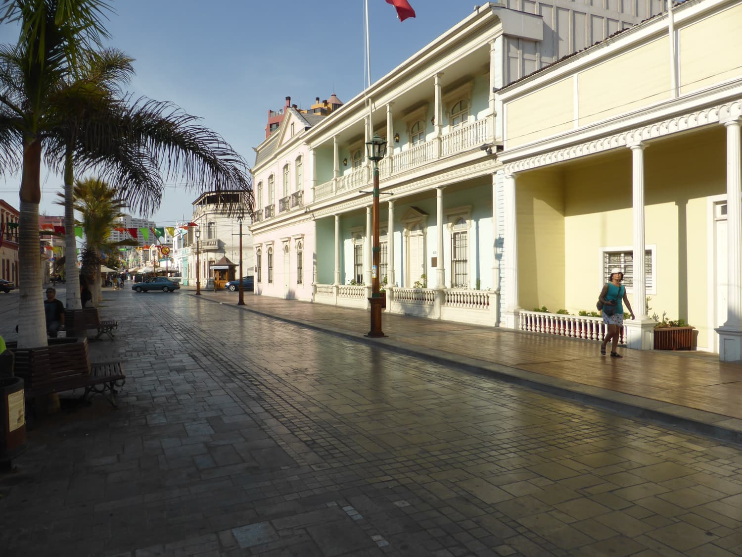 Wooden nitrate-era houses with balconies along the pedestrian Paseo Baquedano in Iquique